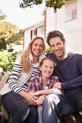 Buy stock photo A portrait of a happy family posing outside their home