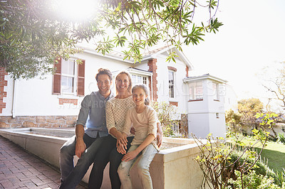 Buy stock photo Portrait, home and family outdoor, smile and bonding with quality time, homeowner and cheerful. Face, mother or father with female child, house and daughter outside, sunshine and real estate property