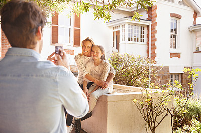Buy stock photo Happy family house, phone and garden photo of kid, mother or people with papa capture outdoor picture. Love hug, cellphone and bonding mom, dad and child relax, smile and enjoy quality time together