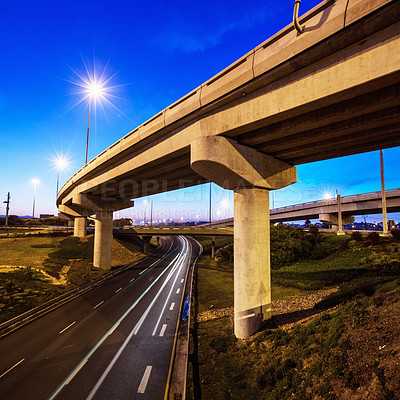 Buy stock photo A cropped shot of a concrete overpass on a stretch of road