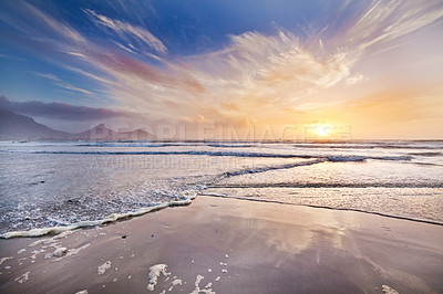 Buy stock photo Shot of a beautiful sunset over the beach