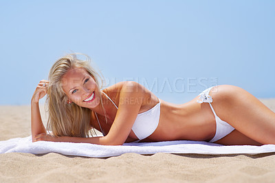 Buy stock photo A sun kissed woman relaxing on the beach in a bikini