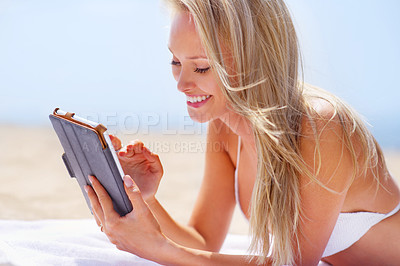 Buy stock photo Woman, tablet and beach on happy holiday, female person and ocean and smile with technology for entertainment. Browse, social media or streaming online on vacation, relax or calm on Miami summer trip