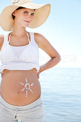 Buy stock photo Summer, beach and portrait of pregnant woman with sunscreen on stomach outdoor with happiness. Healthy, pregnancy and care for body with skincare, cream and lotion at sea on holiday or vacation