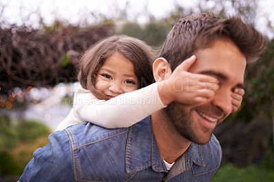 Buy stock photo A little girl and her father playing outdoors