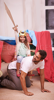 Buy stock photo A cute little girl dressed up as a princess while playing at home with her dad