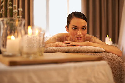 Buy stock photo Candle, smile and portrait of woman at spa for stress relief, aromatherapy or holistic body massage. Female person, peace and happy at luxury hotel for self care, hospitality and natural wellness