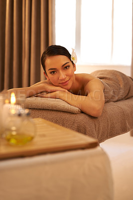 Buy stock photo Hotel, spa and portrait of woman with candle for aromatherapy, stress relief or body massage. Asian person, zen face and peace with smile for hospitality, holistic self care and natural wellness
