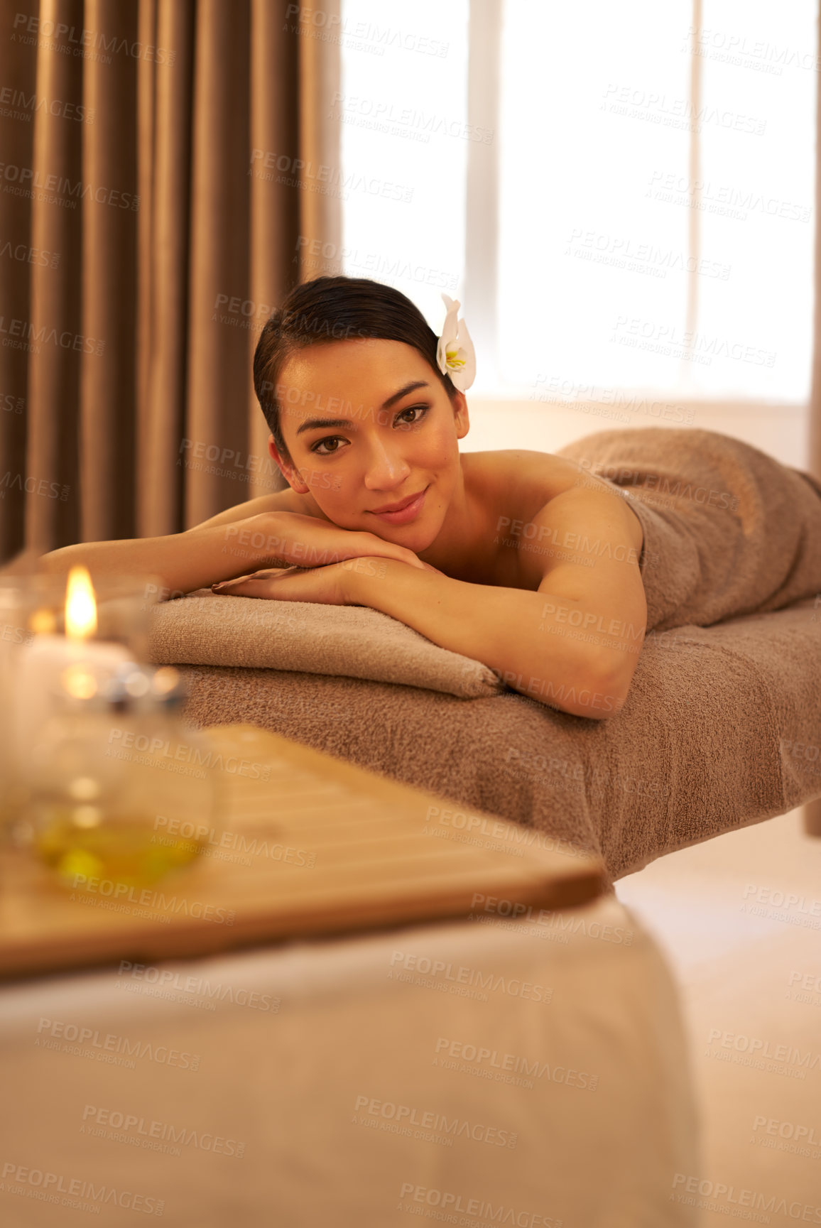Buy stock photo Hotel, spa and portrait of woman with candle for aromatherapy, stress relief or body massage. Asian person, zen face and peace with smile for hospitality, holistic self care and natural wellness
