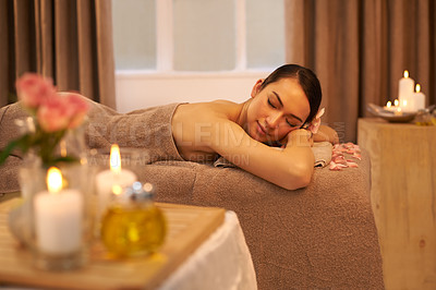 Buy stock photo A beautiful young woman relaxing on a massage table before her massage
