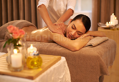 Buy stock photo A beautiful young woman enjoying a massage at the spa