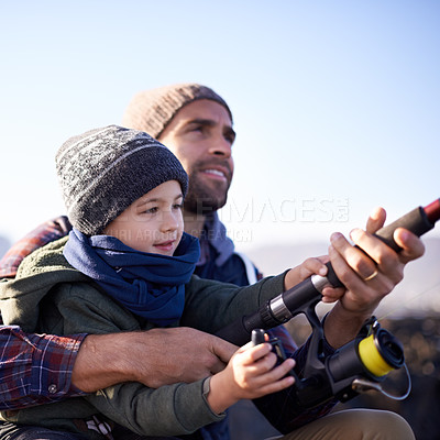 Buy stock photo Water, father and son fishing bonding, outdoor and dad teaching boy in lake or pond together. Parent, male person and man with kid for nature in countryside for peace, happiness and smile of child