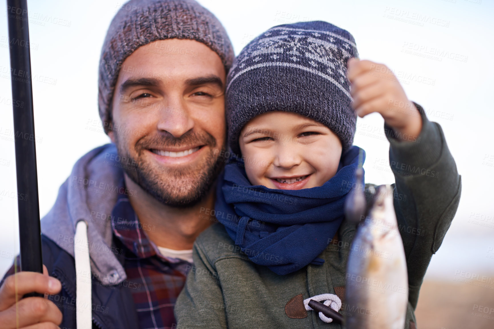 Buy stock photo Portrait, child and smile with father, fish and happiness for achievement on break. Son, water and ocean with pride, adventure and vacation on fishing trip for childhood memories and success at sea