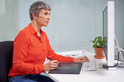 Buy stock photo Mature, businesswoman and computer drawing at desk, draw tablet or internet technology in office for work. Professional female person, online or graphic design job, serious employee in workplace