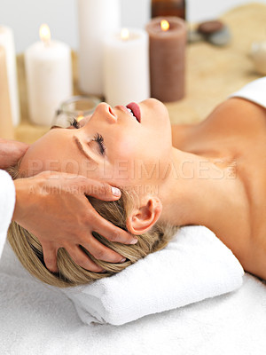 Buy stock photo Resort, spa or candle in head, massage or self care to relax, wellness or mental health as luxury. Retreat, woman or hand in therapy, zen or clinic as chakra, salon or peace of cosmetology table