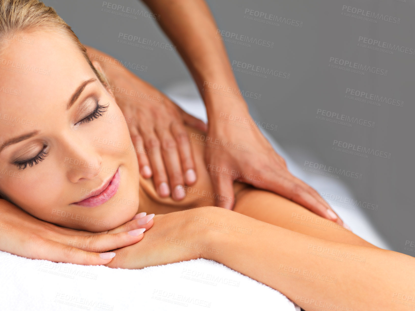 Buy stock photo A beautiful young woman relaxing in a spa - massage therapyy