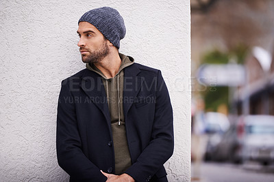 Buy stock photo Fashion, man and thinking in wall outdoor with trendy, cool and style for urban with confident. Male person, choice and planning for weekend or holiday with winter outfit and stylish in Germany