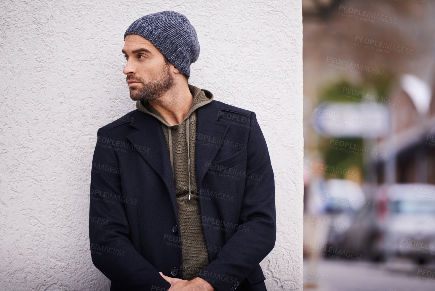 Buy stock photo Fashion, man and thinking in wall outdoor with trendy, cool and style for urban with confident. Male person, choice and planning for weekend or holiday with winter outfit and stylish in Germany