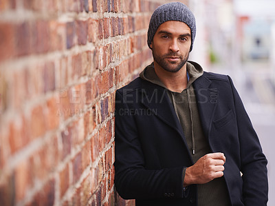 Buy stock photo Man, portrait and urban style by brick wall downtown for aesthetic, modern and vacation for city culture. Male person, trendy winter outfit for streetwear fashion for creative career in New York