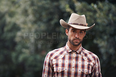 Buy stock photo Man, portrait and outdoor cowboy fashion, western culture and countryside ranch in Texas. Male person, hat and flannel shirt for farmer aesthetic, nature and plaid style by trees or outside bush