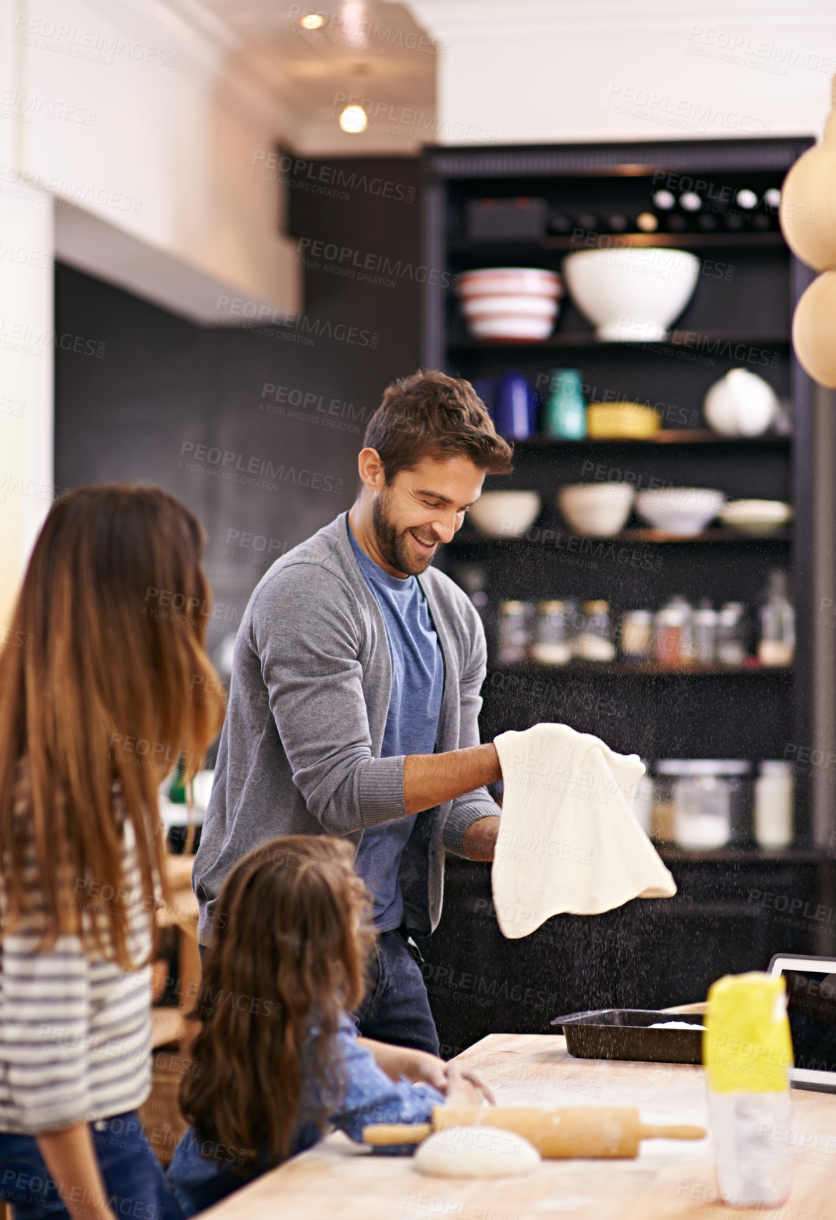 Buy stock photo Child, mother and father with pizza or dough in a kitchen teaching for help, support or learning in home. Family, cooking lesson and girl baking with parents, dad and mom for dinner, supper or lunch