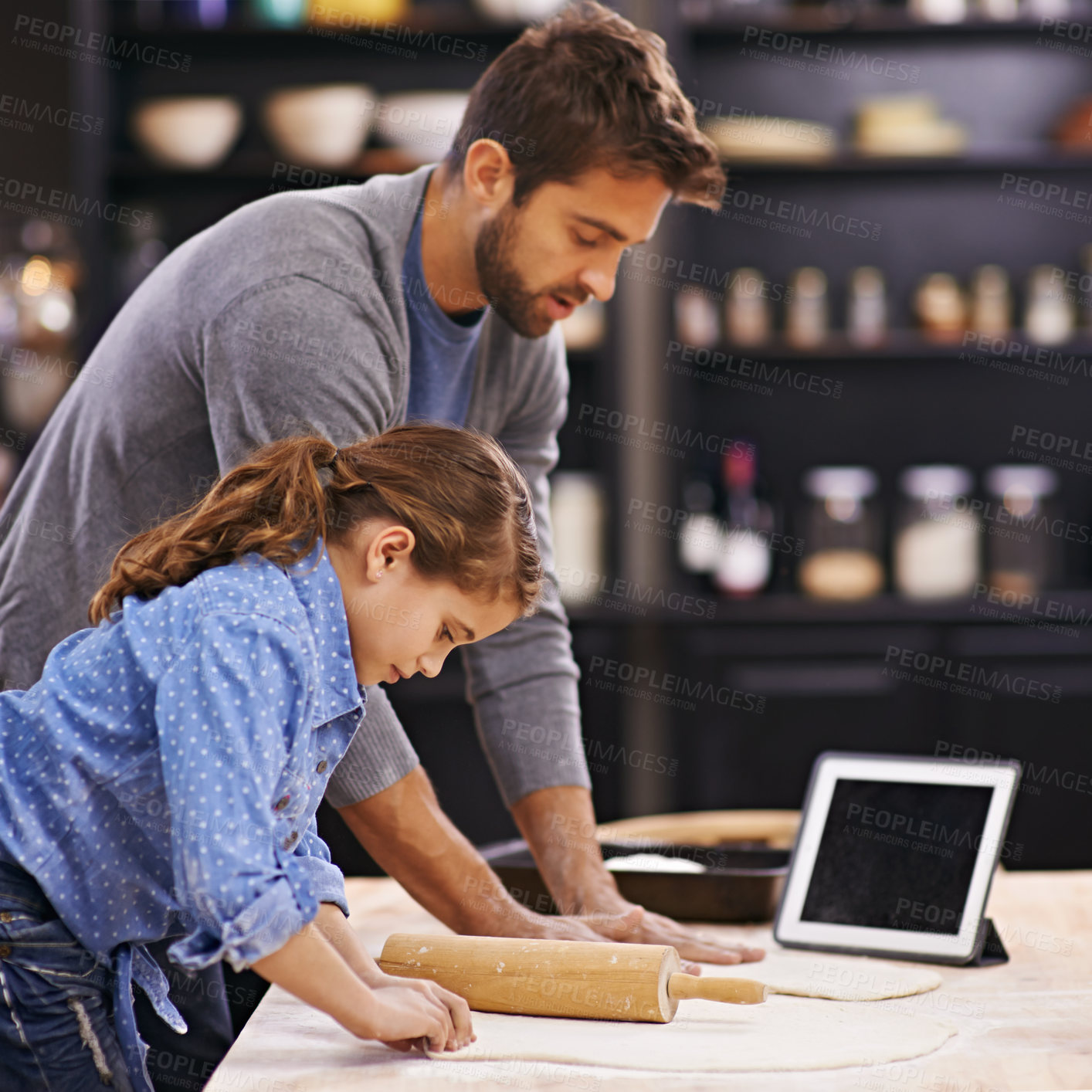 Buy stock photo Pizza, dough and child with father in kitchen and tablet with recipe, guide and learning from online tutorial. Cooking, together and girl help with rolling pin and baking with dad in home for dinner
