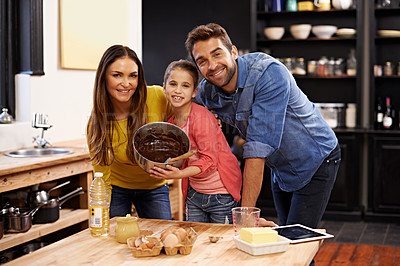 Buy stock photo Parents, girl and portrait for baking with love, ingredients for cake or dessert with support and handmade with care. Mom, dad and kid together in kitchen for bonding or teaching with affection.