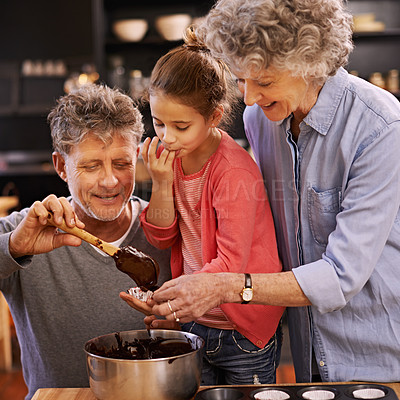 Buy stock photo Teaching, baking and grandparents with girl, smile and ingredients with help and bonding together. Family, senior man or old woman with grandchild, happy or utensils with recipe or hobby in a kitchen