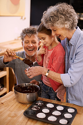 Buy stock photo Help, grandparents and baking with girl, home and hobby with happiness and bonding together with recipe. Family, grandchild and senior man with old woman and activity with utensils, food and teaching