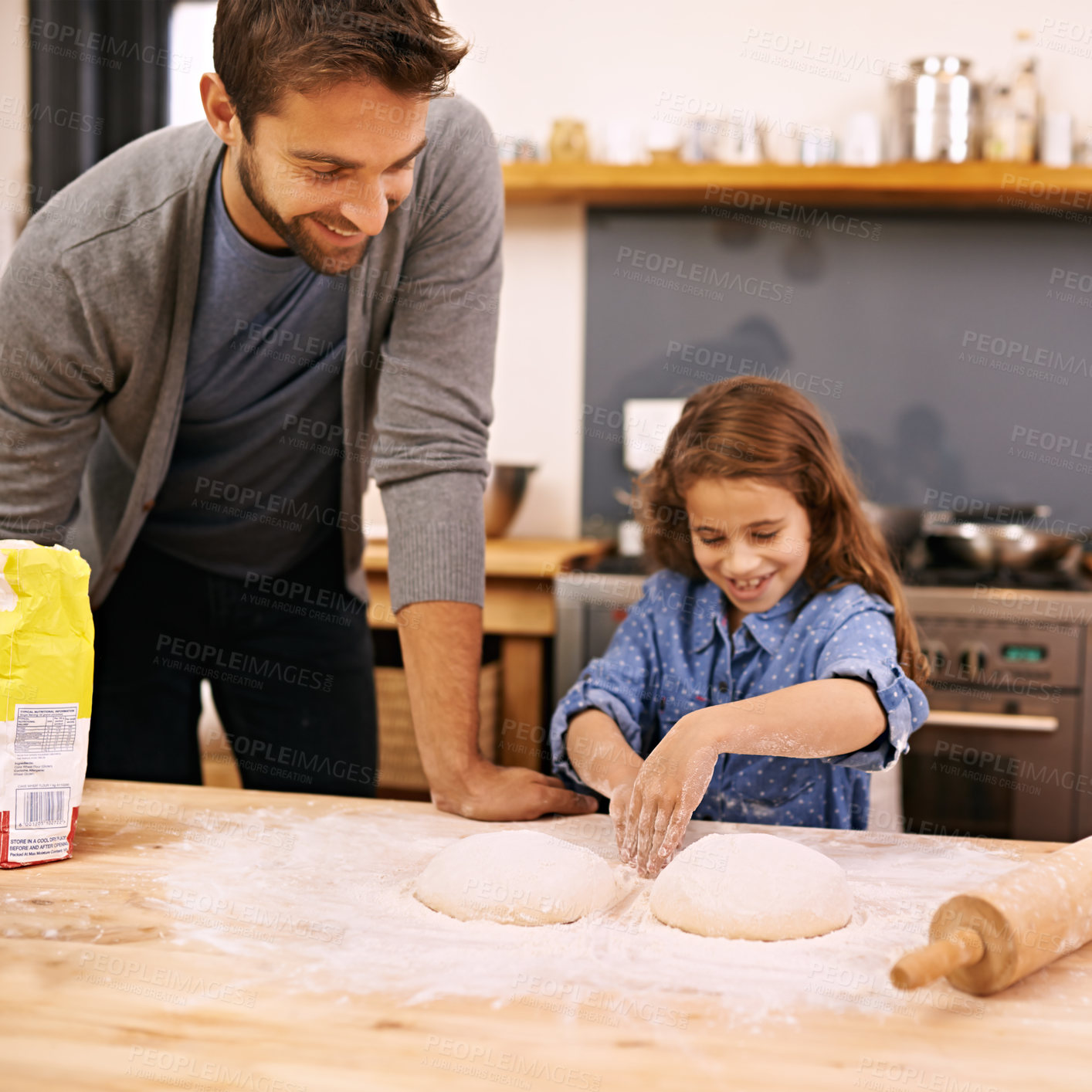 Buy stock photo Father, happy and child hands baking, helping and dough with flour on counter table, parent and kid together and smile. Family home, cooking activity and fun bonding for meal preparation in kitchen