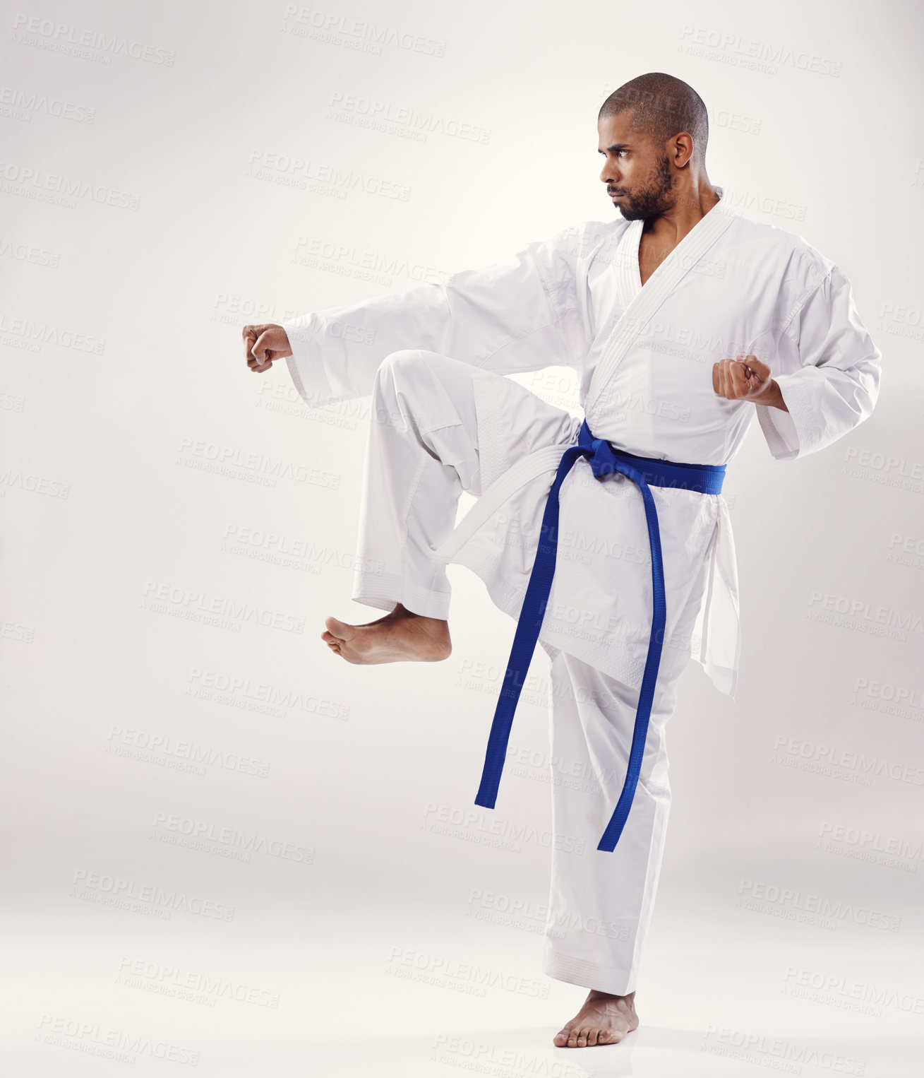 Buy stock photo An african man doing karate