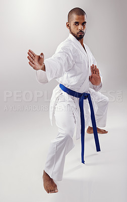 Buy stock photo Studio, sport a d karate for black man, training and exercise for balance of body for physical health. White background, African male person and adult with uechi-ryu for self defense with hands