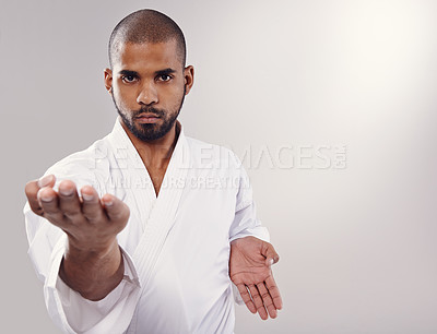 Buy stock photo An african man doing karate