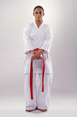 Buy stock photo Woman, portrait and karate athlete in studio, fitness and martial arts on white background. Black person, practice and red belt for taekwondo, discipline and warrior ready for self defense or battle