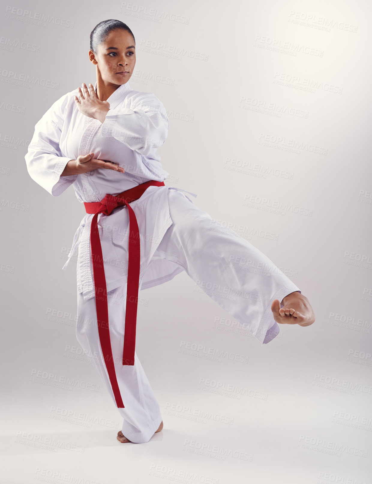 Buy stock photo Shot of a young woman doing karate