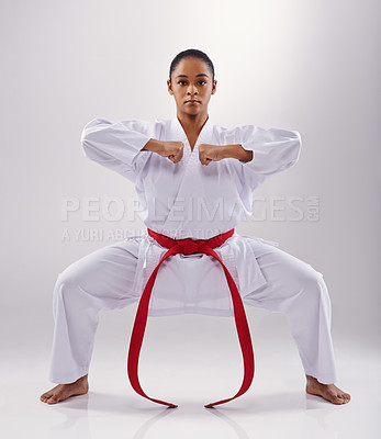 Buy stock photo Woman, portrait and karate fighter in studio, fitness and martial arts on white background. Black person, athlete and red belt for taekwondo, discipline and warrior ready for self defense or battle