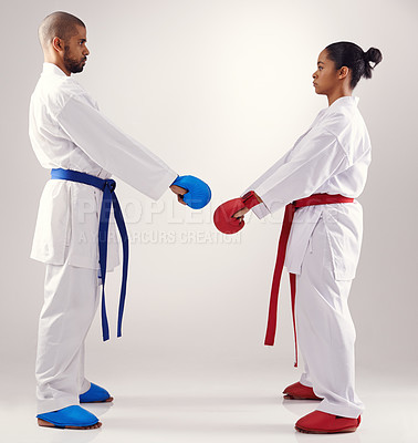 Buy stock photo People, karate and training with gloves in studio on white background to fight or practice for competition. Mma, sport and focus or respect with fitness, commitment and confidence as fighter 