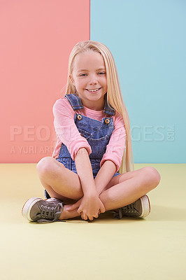 Buy stock photo Portrait, smile and girl on the floor, kid and happiness on a colorful studio background. Model on the ground, mockup space and child with joy and relaxing with break and cheerful with fun and peace