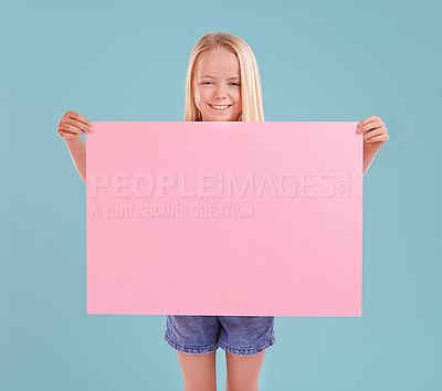 Buy stock photo Child, portrait and poster mockup for announcement presentation in studio, billboard or blue background. Female person, face and paper placard for information banner or opinion, contact us or advert