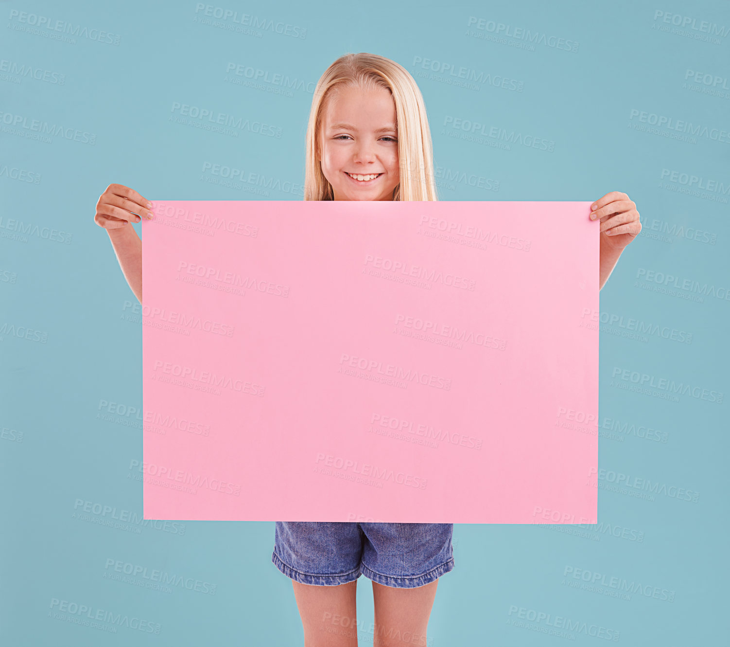 Buy stock photo Child, portrait and poster mockup for announcement presentation in studio, billboard or blue background. Female person, face and paper placard for information banner or opinion, contact us or advert