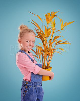 Buy stock photo Portrait, pot and plant with girl, child and happiness with smile on a blue studio background. Face, mockup space and model with nature and funky with decoration and colorful with fun, calm or kid