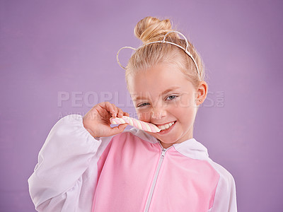 Buy stock photo Studio, portrait and child with candy, marshmallow and tasty dessert for snack in isolated pastel purple background. Sweets, happy childhood and face of young girl for yummy food, hungry and eating