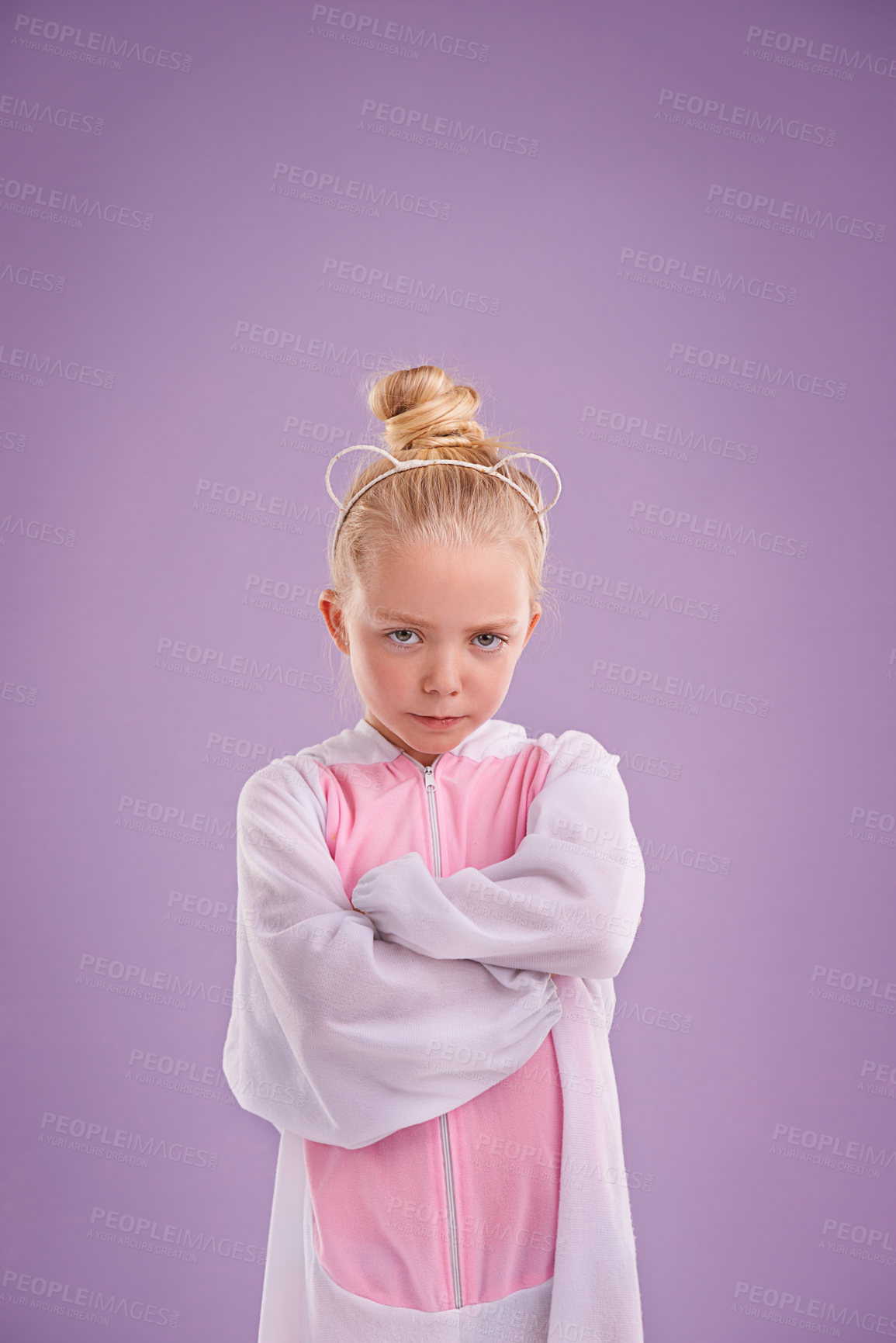 Buy stock photo Girl, bunny and plush with attitude, studio and arms crossed for easter. Child, costume and youth with pastel, rabbit and grumpy for holiday with childhood dress up isolated on purple background