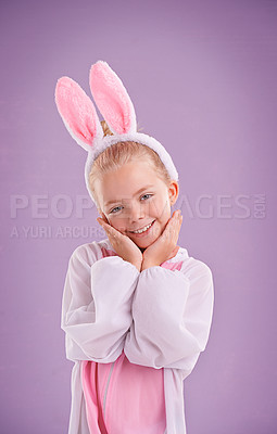 Buy stock photo Girl, bunny and portrait with smile, studio and celebration  for easter holiday. Child, costume and youth with pastel, rabbit and happy for fun cute childhood dress up isolated on purple background