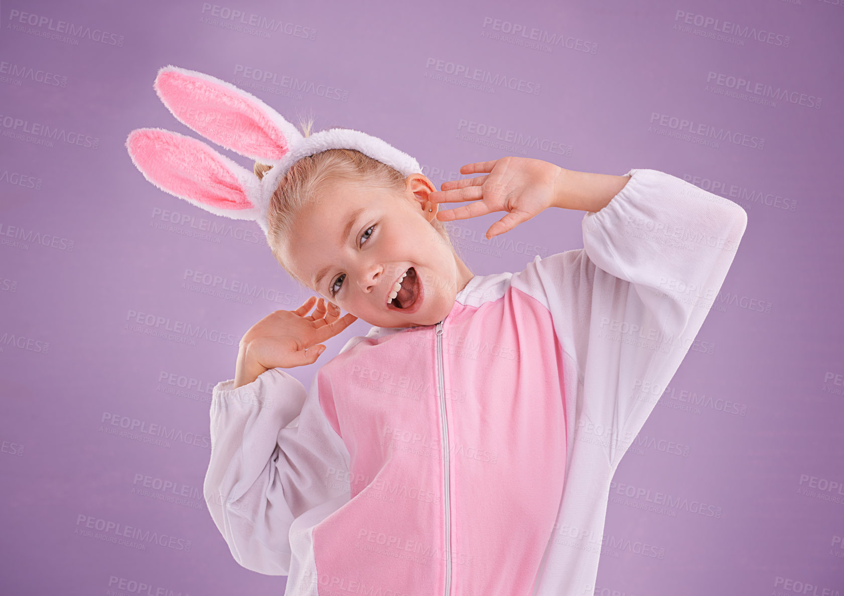 Buy stock photo Portrait, rabbit and girl with costume, excited and Halloween outfit on purple studio background. Face, kid or model with bunny clothes and character with tradition or Easter with expression or funny