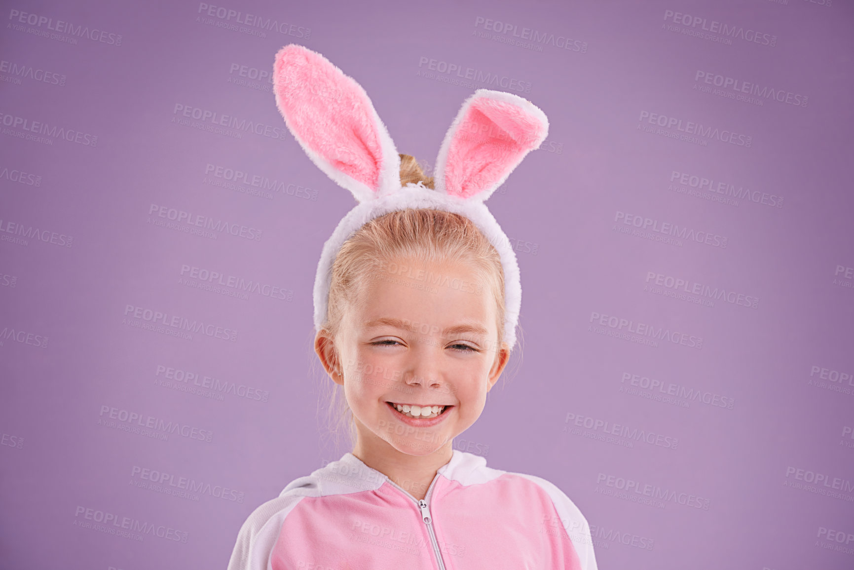 Buy stock photo Child, bunny and portrait with smile, studio and celebration  for easter holiday. Girl, costume and youth with pastel, rabbit and happy for fun cute childhood dress up isolated on purple background
