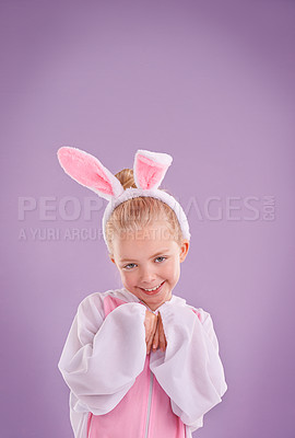 Buy stock photo Portrait, rabbit and girl with costume, happiness and Halloween outfit on a purple studio background. Face, kid and model with bunny clothes and character with smile and Easter holiday with culture