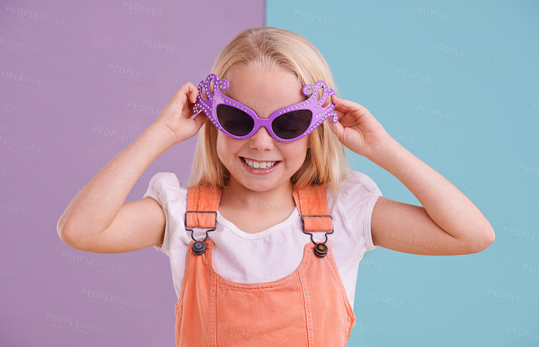 Buy stock photo Girl, child and sunglasses with smile for fashion, groovy style and colour block background. Confidence, young kid and funky face accessory in studio with cool shades, happiness and trendy outfit