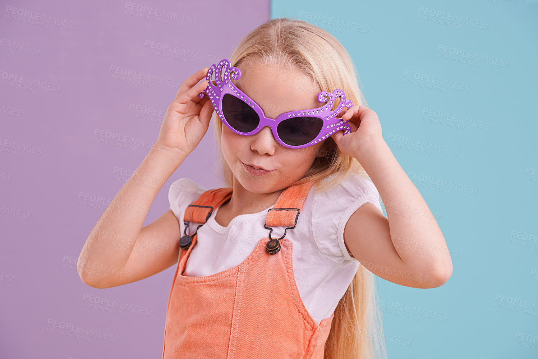 Buy stock photo Sunglasses, pose and girl with fashion for style, groovy clothes and colour block background. Young kid, confidence and pout with groovy accessory for emoji, happiness and trendy outfit in studio