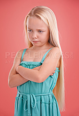 Buy stock photo Frustrated, angry and girl with expression for sad, bad mood and unhappy in childhood isolated in studio background. Female child, gen z kid and arms crossed for tantrum, disappointment and serious